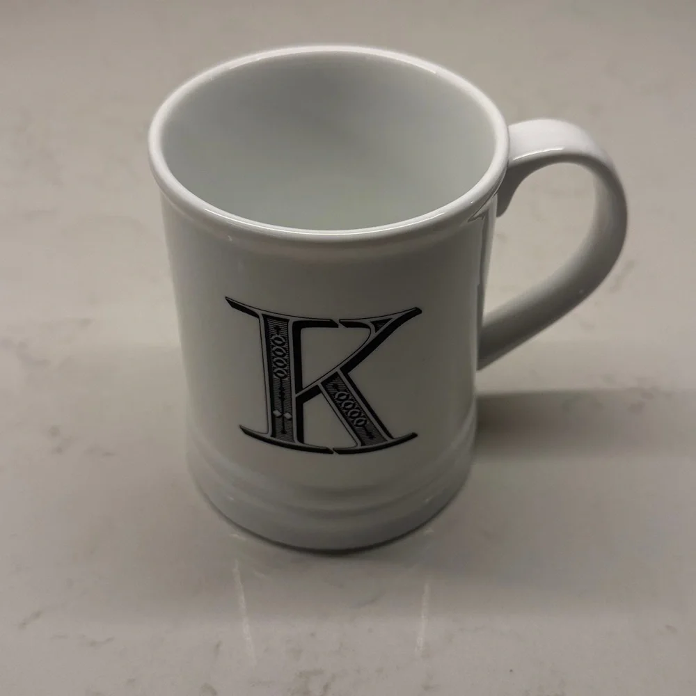 Schurman Retail Group “K” Initial White Monogrammed Mug with Black Lettering